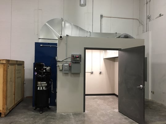 action booth dust collector installed in grinding facility